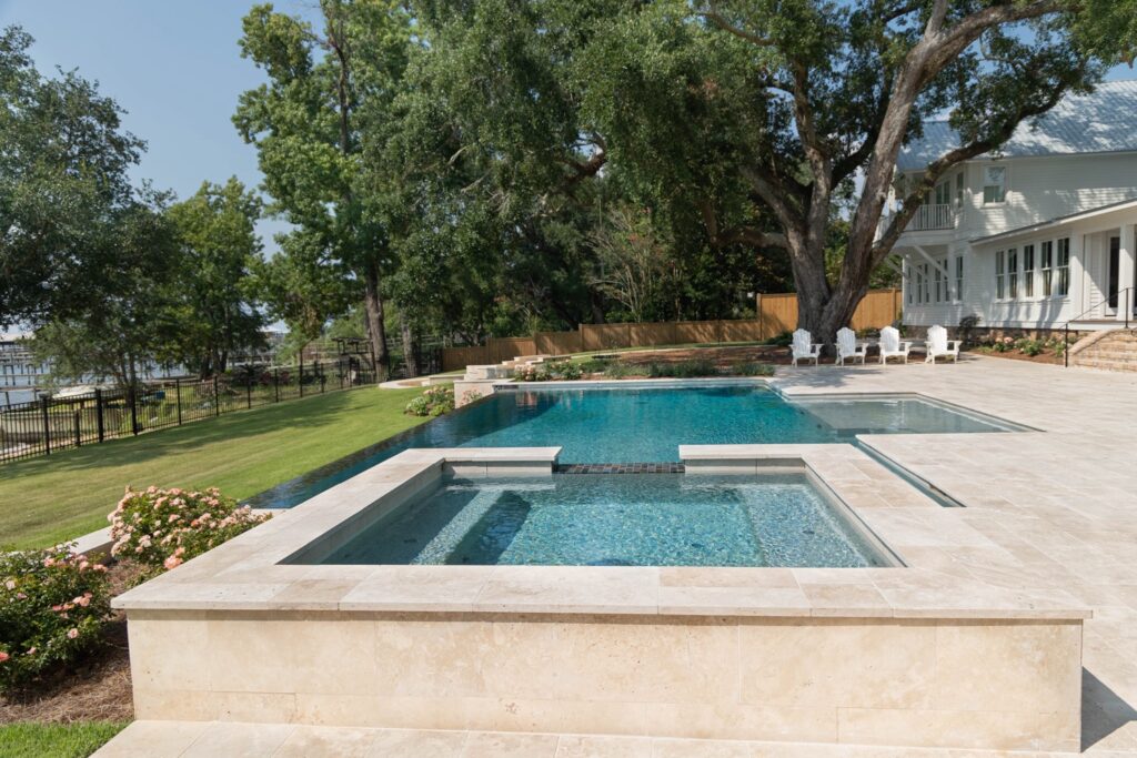 Pool Builders in Ebro, FL 7 Custom gunite pool with tanning ledge by Southern Poolscapes